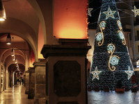 A big Christmas tree and Christmas lights adorn the arcades and city center in Cava de'Tirreni, Salerno, Italy, on December 11, 2024. (