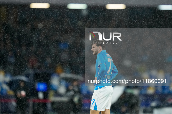 Khvicha Kvaratskhelia of SSC Napoli reacts in the rain during the serie Serie A Enilive match between SSC Napoli and SS Lazio at Stadio Dieg...