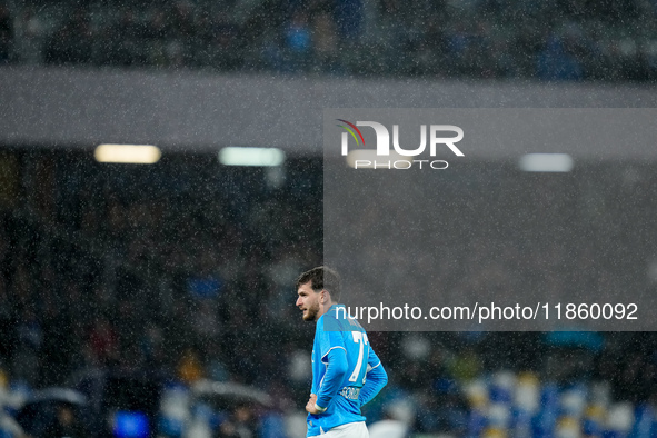 Khvicha Kvaratskhelia of SSC Napoli reacts in the rain during the serie Serie A Enilive match between SSC Napoli and SS Lazio at Stadio Dieg...