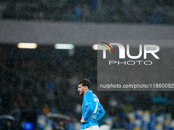 Khvicha Kvaratskhelia of SSC Napoli reacts in the rain during the serie Serie A Enilive match between SSC Napoli and SS Lazio at Stadio Dieg...