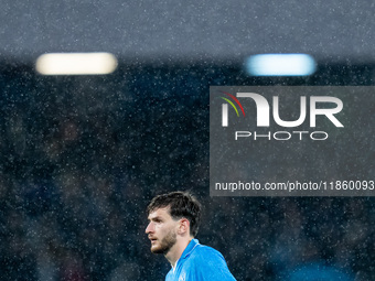 Khvicha Kvaratskhelia of SSC Napoli reacts in the rain during the serie Serie A Enilive match between SSC Napoli and SS Lazio at Stadio Dieg...