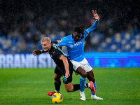 Andre-Frank Zambo Anguissa of SSC Napoli and Gustav Isaksen of SS Lazio compete for the ball during the serie Serie A Enilive match between...