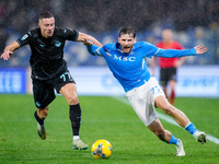 Adam Marusic of SS Lazio and Khvicha Kvaratskhelia of SSC Napoli compete for the ball during the serie Serie A Enilive match between SSC Nap...