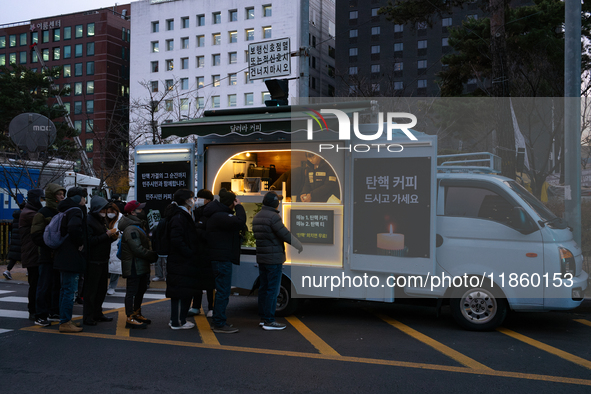 At the rally across from the National Assembly in Seoul, South Korea, on December 12, 2024, thousands of citizens gather to call for the imp...