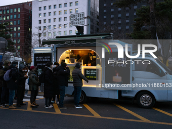 At the rally across from the National Assembly in Seoul, South Korea, on December 12, 2024, thousands of citizens gather to call for the imp...