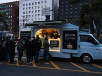 At the rally across from the National Assembly in Seoul, South Korea, on December 12, 2024, thousands of citizens gather to call for the imp...