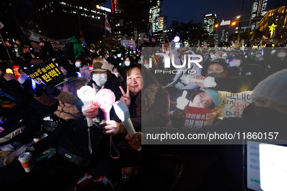 Thousands of citizens gather across from the National Assembly to call for the impeachment of President Yoon Suk-yeol in Seoul, South Korea,...