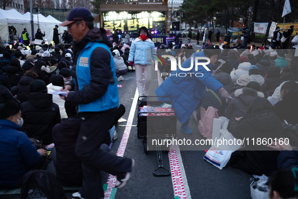 Thousands of citizens gather across from the National Assembly to call for the impeachment of President Yoon Suk-yeol in Seoul, South Korea,...