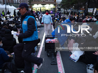 Thousands of citizens gather across from the National Assembly to call for the impeachment of President Yoon Suk-yeol in Seoul, South Korea,...