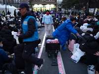 Thousands of citizens gather across from the National Assembly to call for the impeachment of President Yoon Suk-yeol in Seoul, South Korea,...