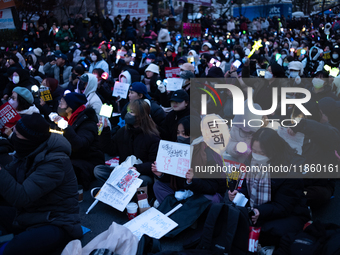 Thousands of citizens gather across from the National Assembly to call for the impeachment of President Yoon Suk-yeol in Seoul, South Korea,...