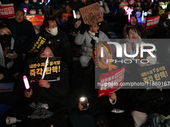 Thousands of citizens gather across from the National Assembly to call for the impeachment of President Yoon Suk-yeol in Seoul, South Korea,...