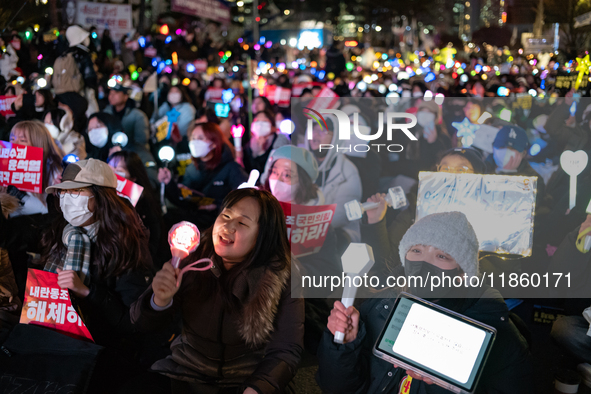 Thousands of citizens gather across from the National Assembly to call for the impeachment of President Yoon Suk-yeol in Seoul, South Korea,...