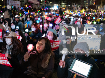 Thousands of citizens gather across from the National Assembly to call for the impeachment of President Yoon Suk-yeol in Seoul, South Korea,...