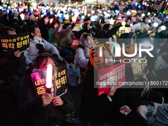 Thousands of citizens gather across from the National Assembly to call for the impeachment of President Yoon Suk-yeol in Seoul, South Korea,...