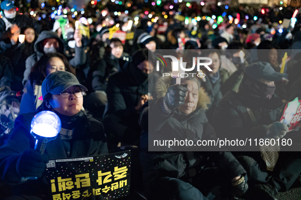 Thousands of citizens gather across from the National Assembly to call for the impeachment of President Yoon Suk-yeol in Seoul, South Korea,...