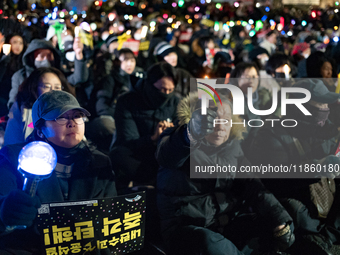 Thousands of citizens gather across from the National Assembly to call for the impeachment of President Yoon Suk-yeol in Seoul, South Korea,...