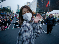 A student who completes the college entrance exam this year dances while participating in a protest calling for the impeachment of President...