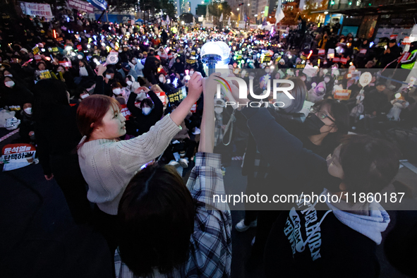 At a protest demanding the impeachment and urgent arrest of President Yoon Suk Yeol in Yeouido, Seoul, South Korea, on December 12, 2024, pa...