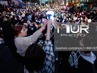 At a protest demanding the impeachment and urgent arrest of President Yoon Suk Yeol in Yeouido, Seoul, South Korea, on December 12, 2024, pa...