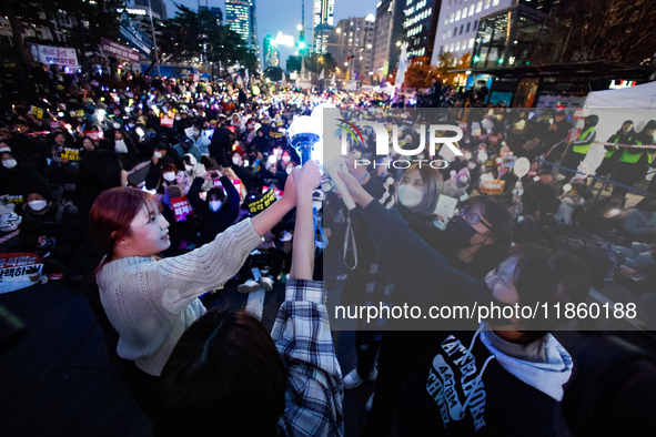 At a protest demanding the impeachment and urgent arrest of President Yoon Suk Yeol in Yeouido, Seoul, South Korea, on December 12, 2024, pa...