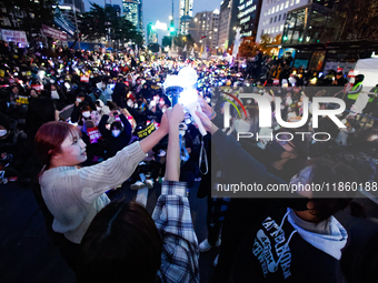 At a protest demanding the impeachment and urgent arrest of President Yoon Suk Yeol in Yeouido, Seoul, South Korea, on December 12, 2024, pa...