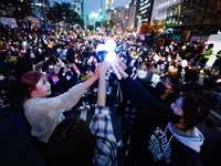 At a protest demanding the impeachment and urgent arrest of President Yoon Suk Yeol in Yeouido, Seoul, South Korea, on December 12, 2024, pa...