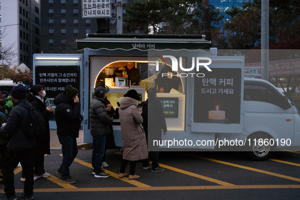 At the rally across from the National Assembly in Seoul, South Korea, on December 12, 2024, thousands of citizens gather to call for the imp...