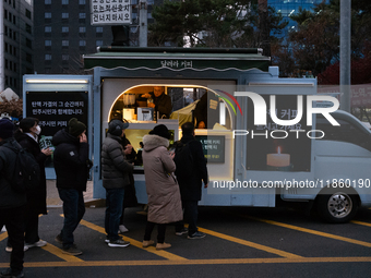 At the rally across from the National Assembly in Seoul, South Korea, on December 12, 2024, thousands of citizens gather to call for the imp...