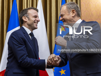 Prime Minister Donald Tusk (R) and French President Emmanuel Macron during a meeting at the Prime Minister's Office in Warsaw. The leaders w...