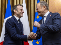 Prime Minister Donald Tusk (R) and French President Emmanuel Macron during a meeting at the Prime Minister's Office in Warsaw. The leaders w...