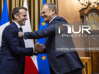 Prime Minister Donald Tusk (R) and French President Emmanuel Macron during a meeting at the Prime Minister's Office in Warsaw. The leaders w...