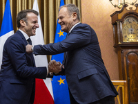 Prime Minister Donald Tusk (R) and French President Emmanuel Macron during a meeting at the Prime Minister's Office in Warsaw. The leaders w...