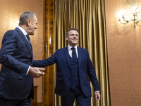 Prime Minister Donald Tusk (L) and French President Emmanuel Macron during a meeting at the Prime Minister's Office in Warsaw. The leaders w...