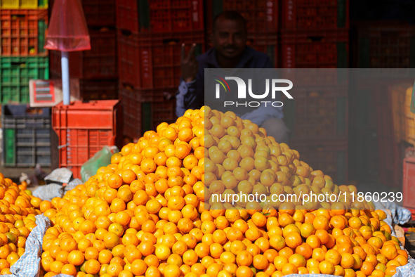 A pile of oranges is pictured at a marketplace in Kathmandu, Nepal, on December 12, 2024. Nepali fruit markets are flooded with oranges as t...