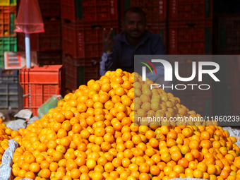 A pile of oranges is pictured at a marketplace in Kathmandu, Nepal, on December 12, 2024. Nepali fruit markets are flooded with oranges as t...