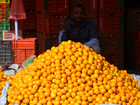 A pile of oranges is pictured at a marketplace in Kathmandu, Nepal, on December 12, 2024. Nepali fruit markets are flooded with oranges as t...