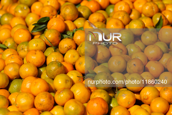 Oranges are pictured at a marketplace in Kathmandu, Nepal, on December 12, 2024. Nepali fruit markets are flooded with oranges as the season...