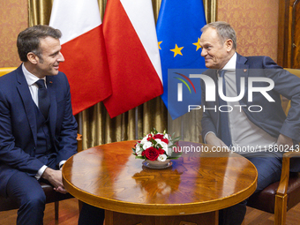 Prime Minister Donald Tusk (R) and French President Emmanuel Macron during a meeting at the Prime Minister's Office in Warsaw. The leaders w...