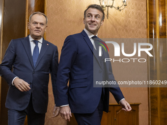 Prime Minister Donald Tusk (L) and French President Emmanuel Macron during a meeting at the Prime Minister's Office in Warsaw. The leaders w...