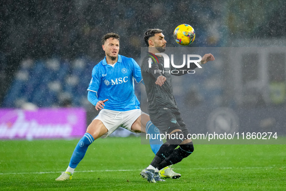 Taty Castellanos of SS Lazio and Amir Rrahmani of SSC Napoli compete for the ball during the serie Serie A Enilive match between SSC Napoli...