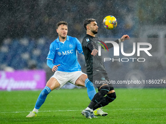 Taty Castellanos of SS Lazio and Amir Rrahmani of SSC Napoli compete for the ball during the serie Serie A Enilive match between SSC Napoli...