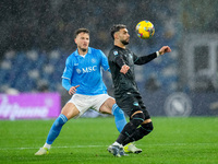 Taty Castellanos of SS Lazio and Amir Rrahmani of SSC Napoli compete for the ball during the serie Serie A Enilive match between SSC Napoli...