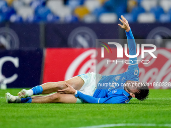 Khvicha Kvaratskhelia of SSC Napoli lies down injured during the serie Serie A Enilive match between SSC Napoli and SS Lazio at Stadio Diego...