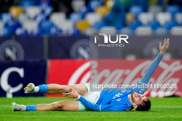 Khvicha Kvaratskhelia of SSC Napoli lies down injured during the serie Serie A Enilive match between SSC Napoli and SS Lazio at Stadio Diego...