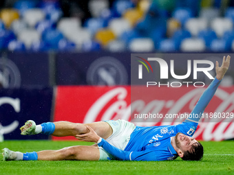 Khvicha Kvaratskhelia of SSC Napoli lies down injured during the serie Serie A Enilive match between SSC Napoli and SS Lazio at Stadio Diego...