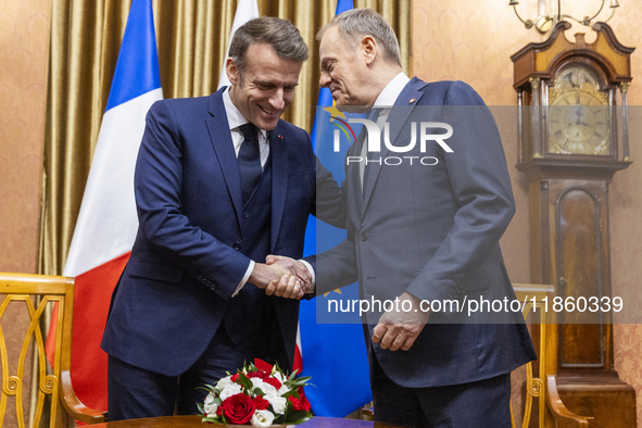 Prime Minister Donald Tusk (R) and French President Emmanuel Macron during a meeting at the Prime Minister's Office in Warsaw. The leaders w...