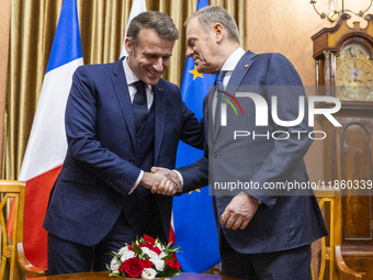 Prime Minister Donald Tusk (R) and French President Emmanuel Macron during a meeting at the Prime Minister's Office in Warsaw. The leaders w...