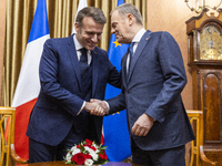 Prime Minister Donald Tusk (R) and French President Emmanuel Macron during a meeting at the Prime Minister's Office in Warsaw. The leaders w...