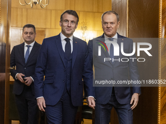 Prime Minister Donald Tusk (L) and French President Emmanuel Macron during a meeting at the Prime Minister's Office in Warsaw. The leaders w...